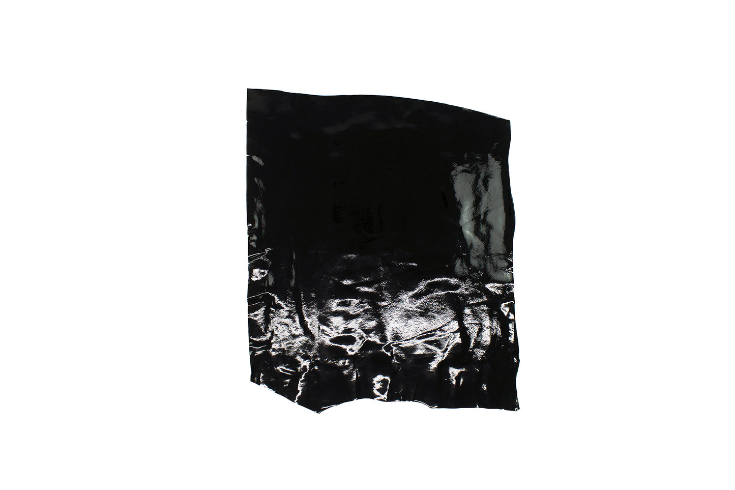 Piece of black wrinkled patent leather