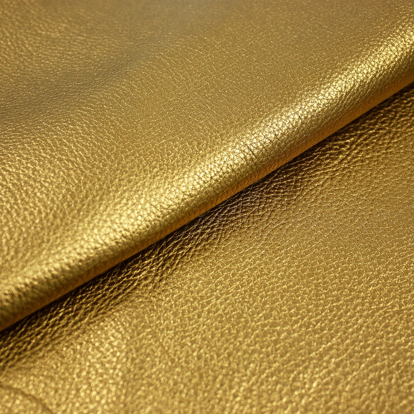 Piece of gold laminated pumped bovine leather