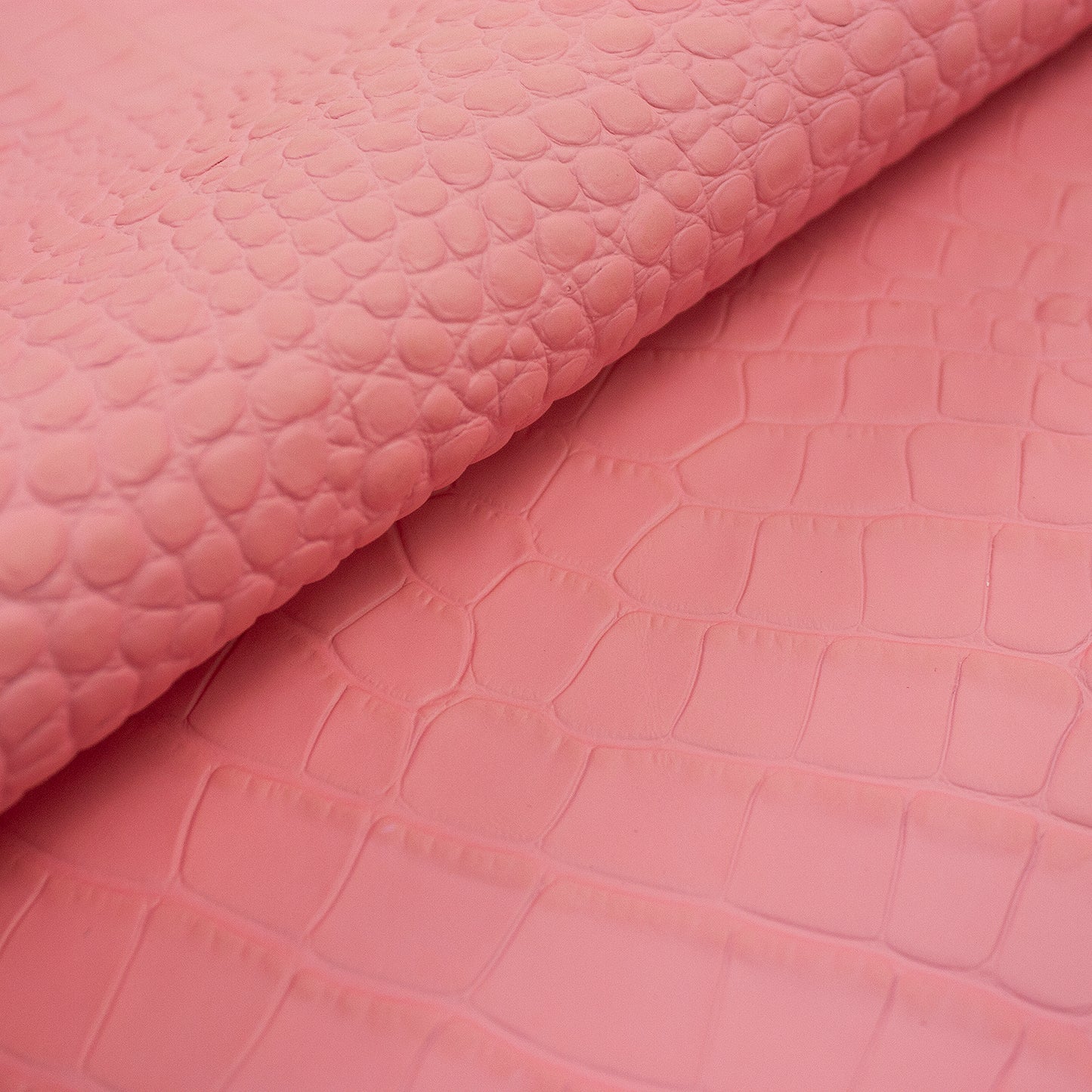 Bubblegum pink crocodile embossed leather