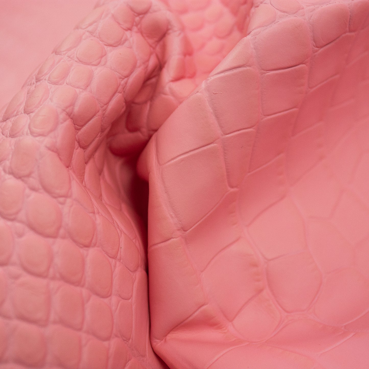 Bubblegum pink crocodile embossed leather