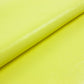 Piece of yellow wrinkled patent leather