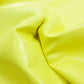 Piece of yellow wrinkled patent leather