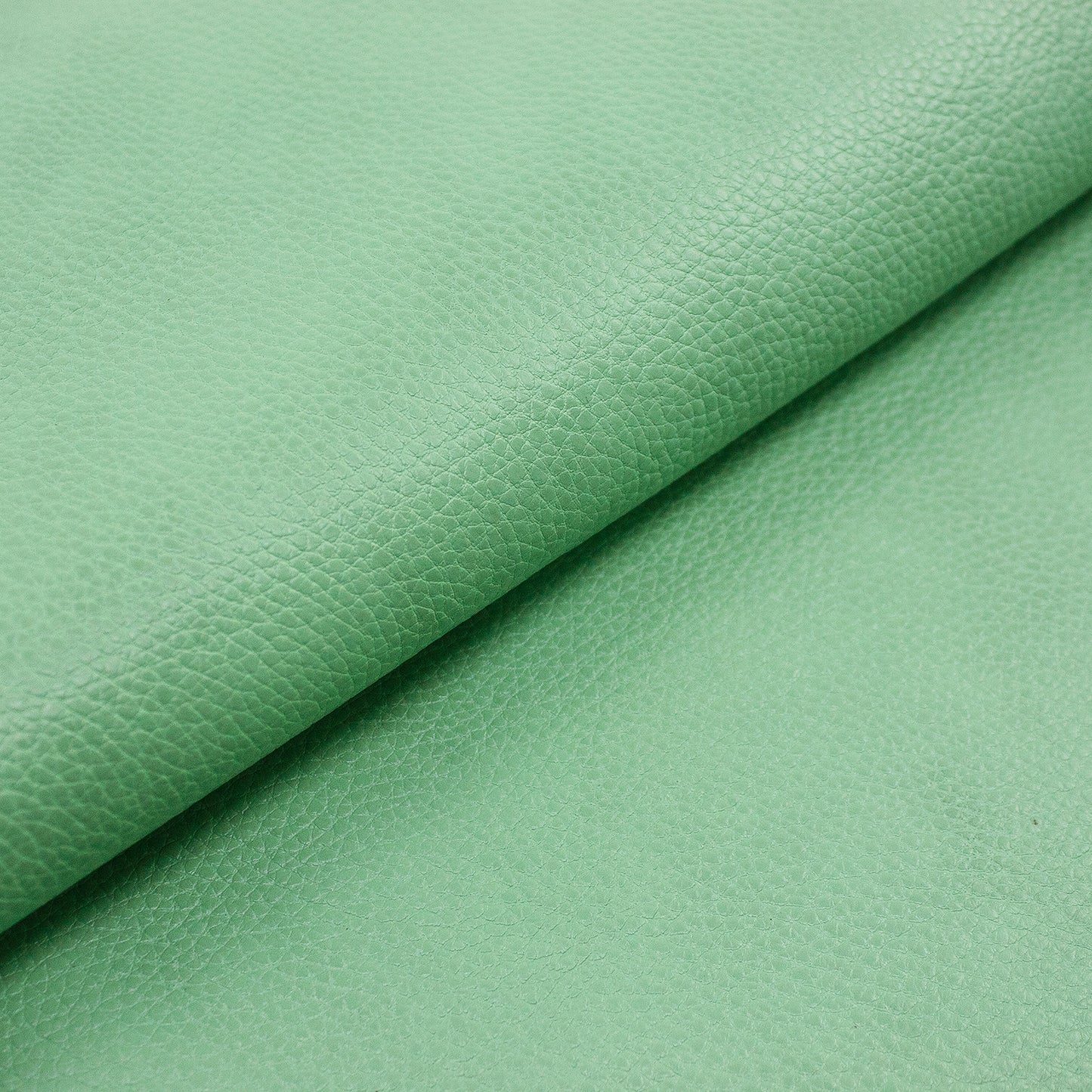 Piece of cowhide embossed with smoked aquamarine