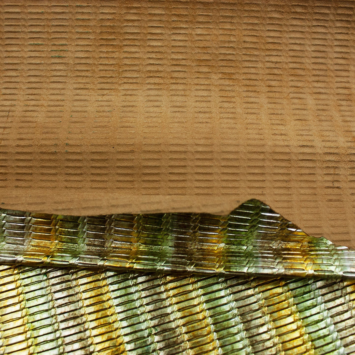 Piece of multicolored braided engraved leather