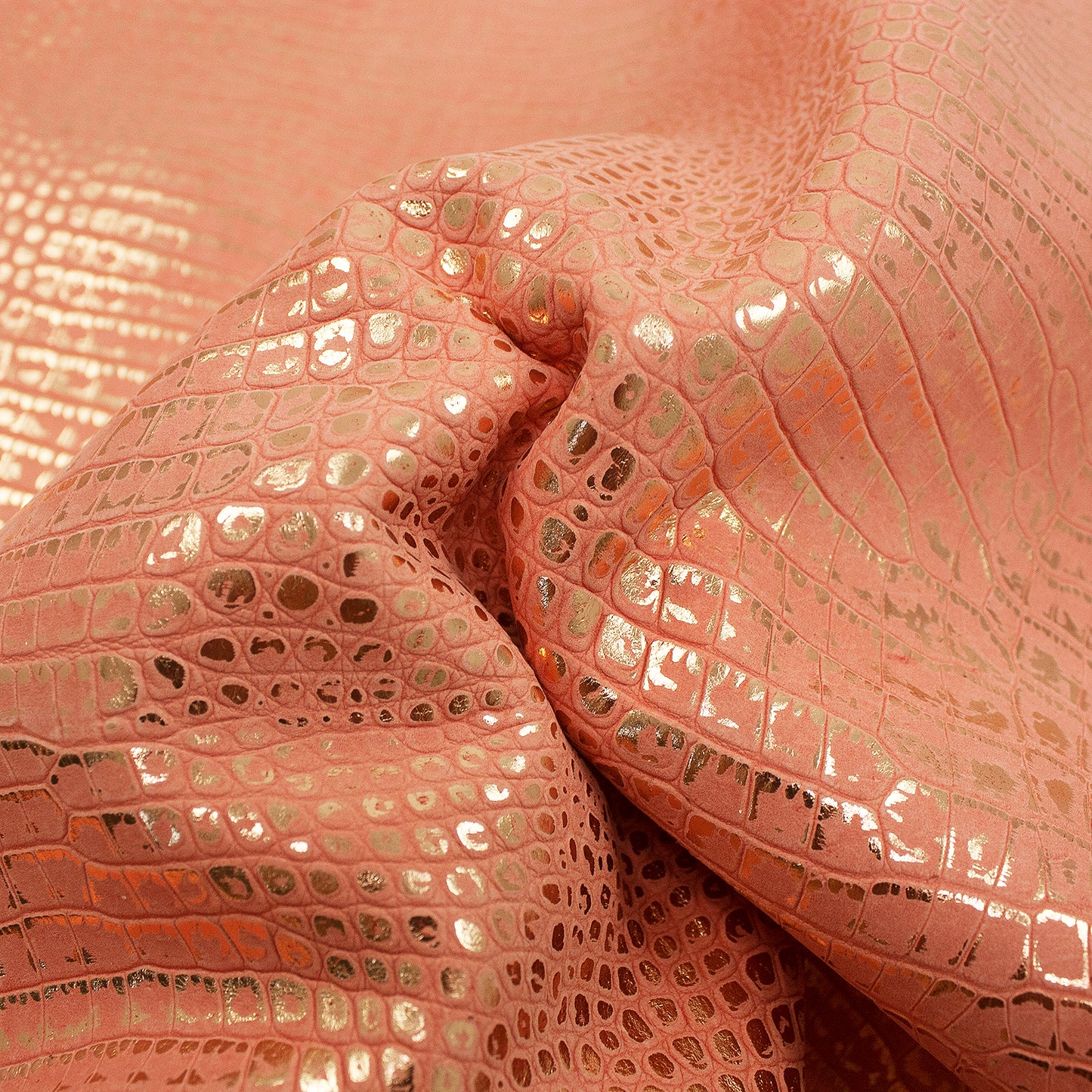 Rose gold crocodile embossed leather piece