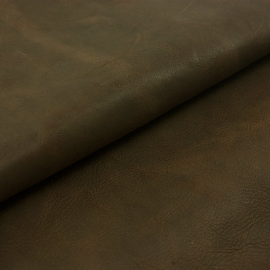 Pieces of dark brown rustic cowhide