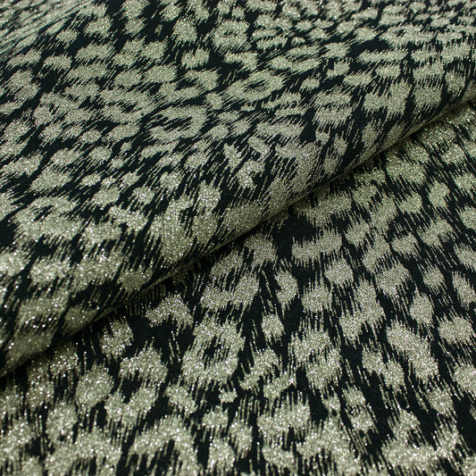 Trozo de tejido manchas plateadas