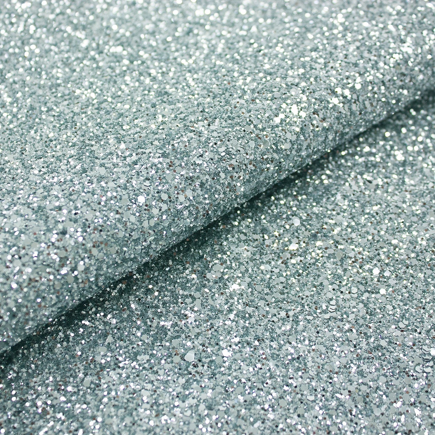 Trozo de tejido purpurina plata