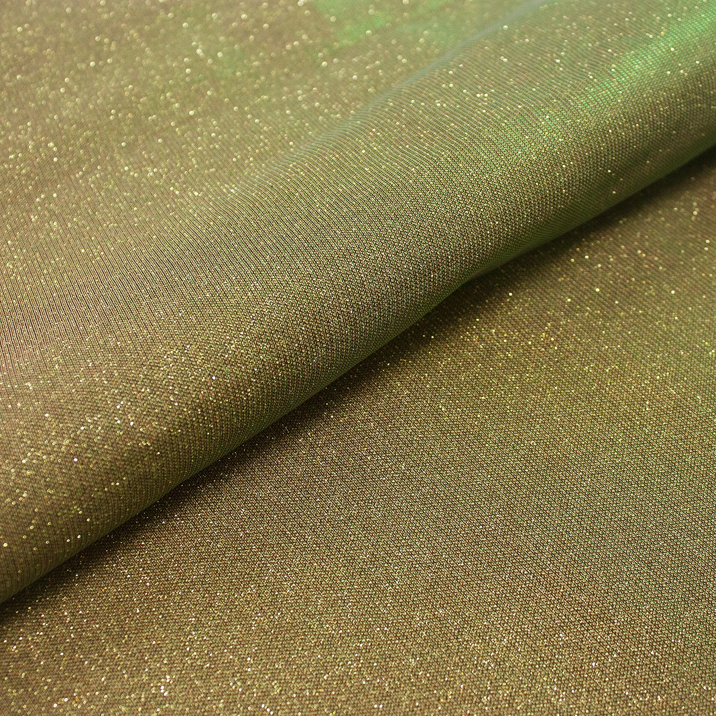 Trozo de tejido purpurina dorada tornasol