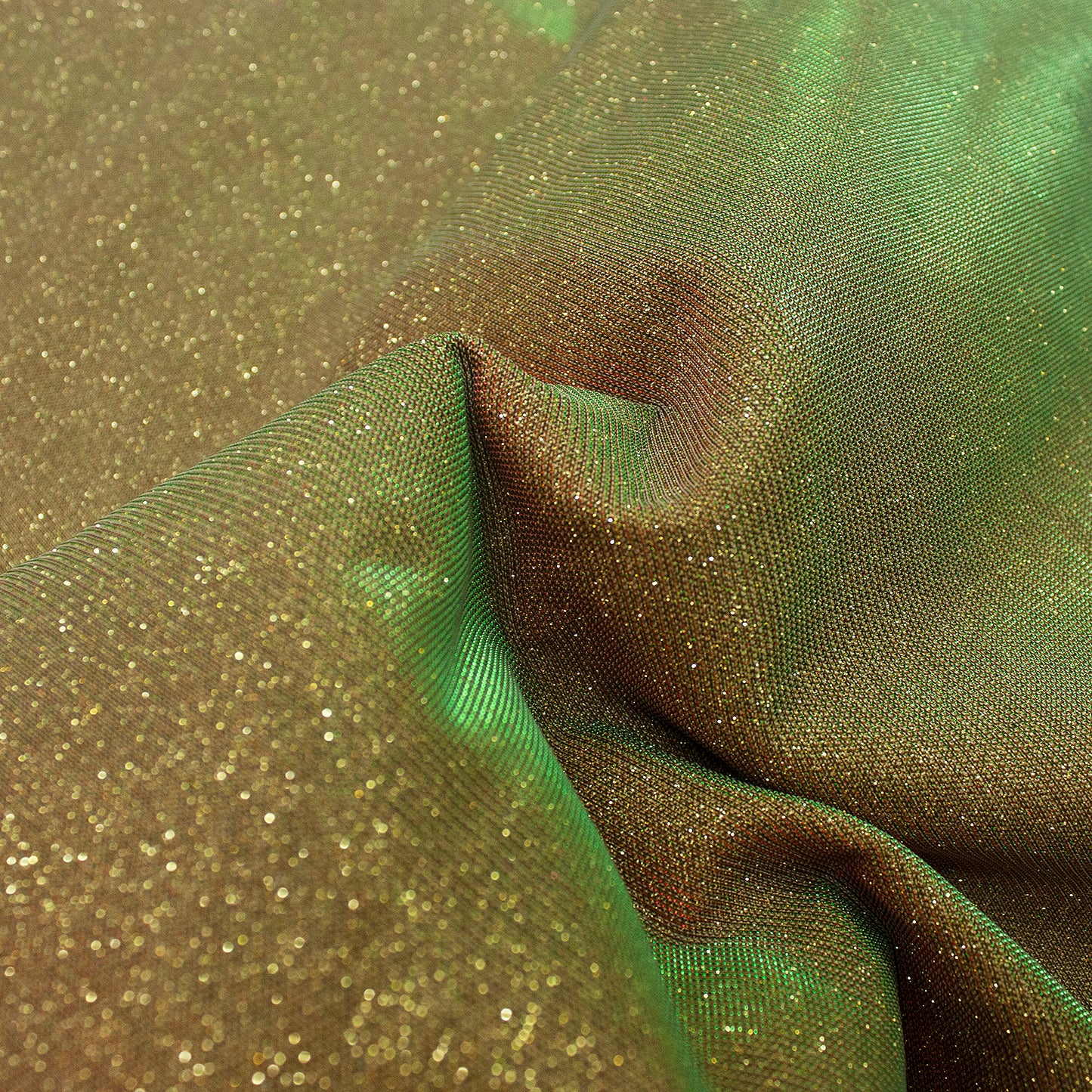 Trozo de tejido purpurina dorada tornasol