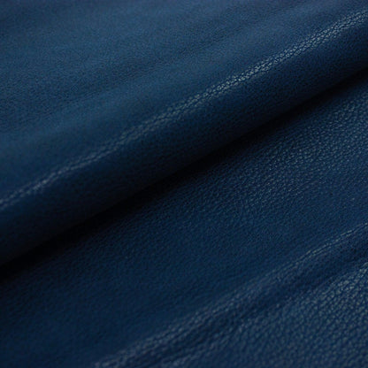 Piece of worn blue fantasy leather