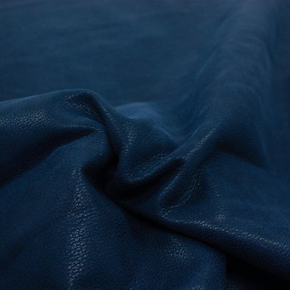 Piece of worn blue fantasy leather