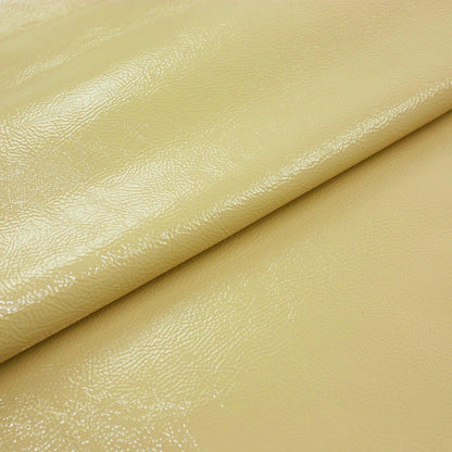 Wrinkled pastel yellow patent leather