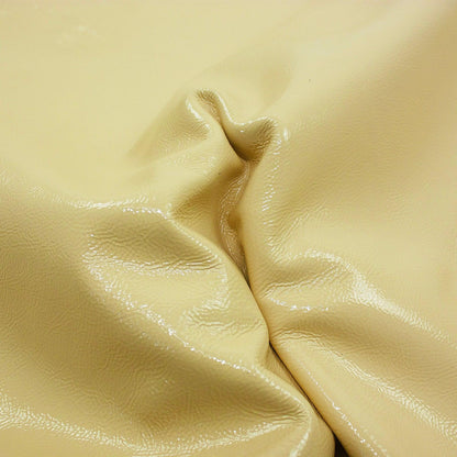 Wrinkled pastel yellow patent leather