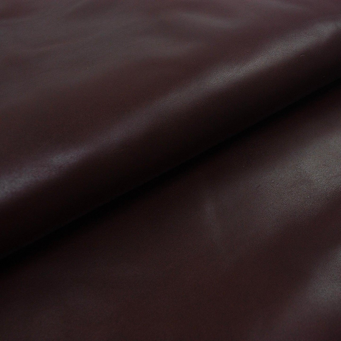 Aged mahogany brown cowhide leather piece