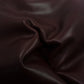 Aged mahogany brown cowhide leather piece