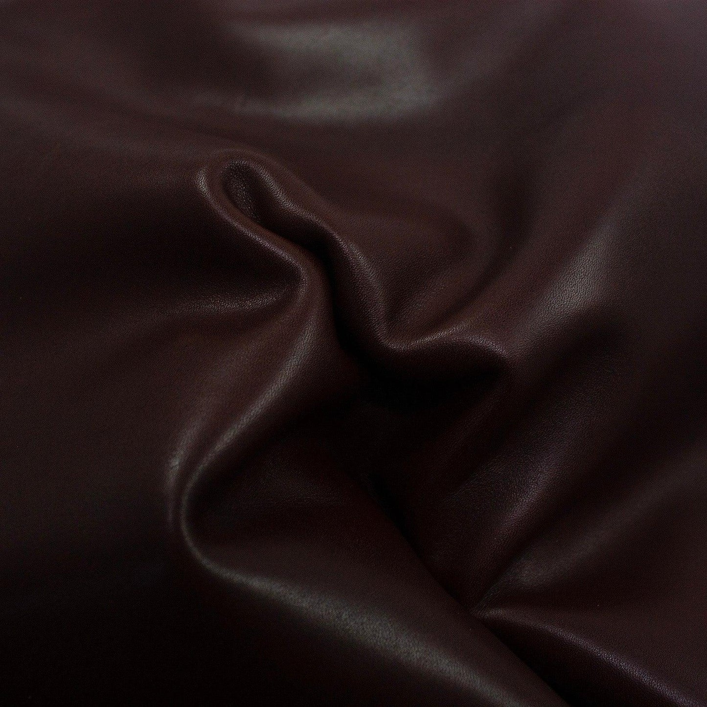 Aged mahogany brown cowhide leather piece