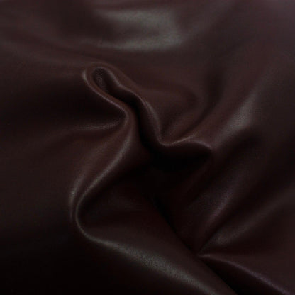 Aged mahogany brown cowhide leather piece