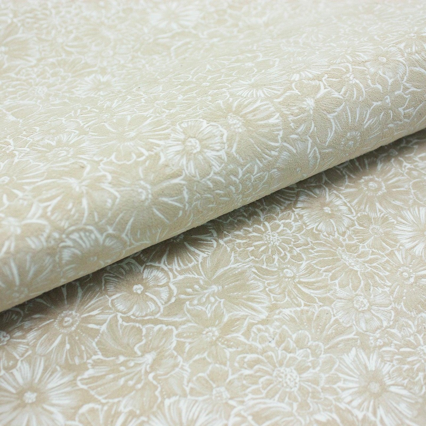 Piece of beige floral fantasy leather