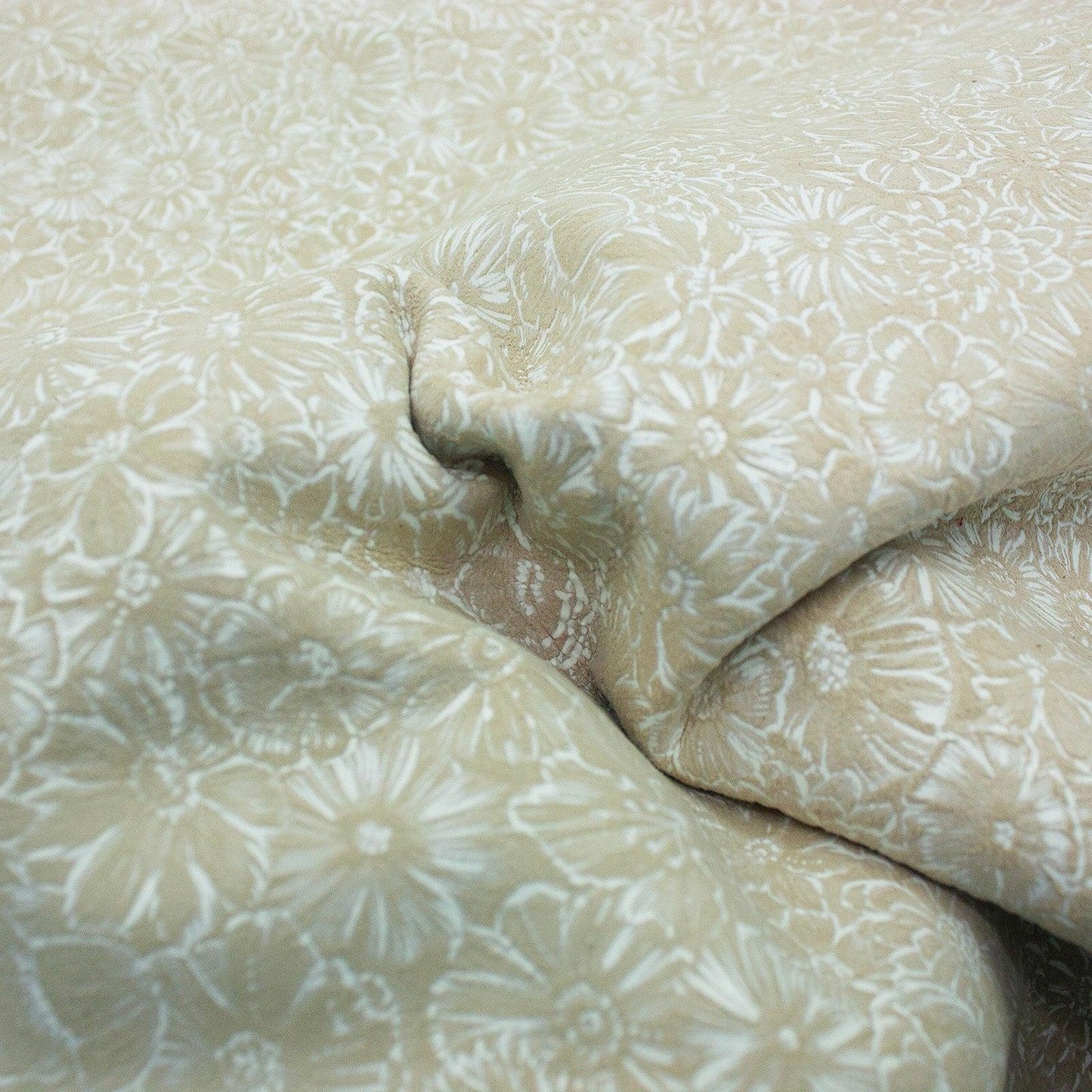 Piece of beige floral fantasy leather