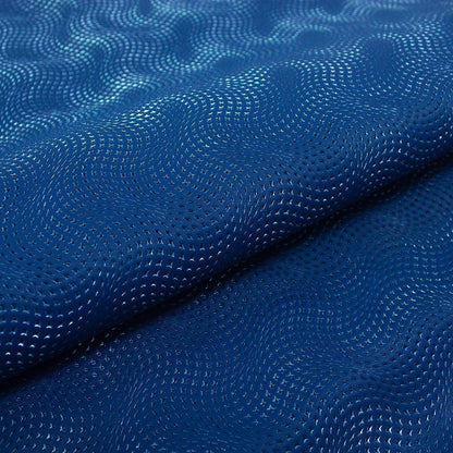 Piece of engraved leather, blue waves