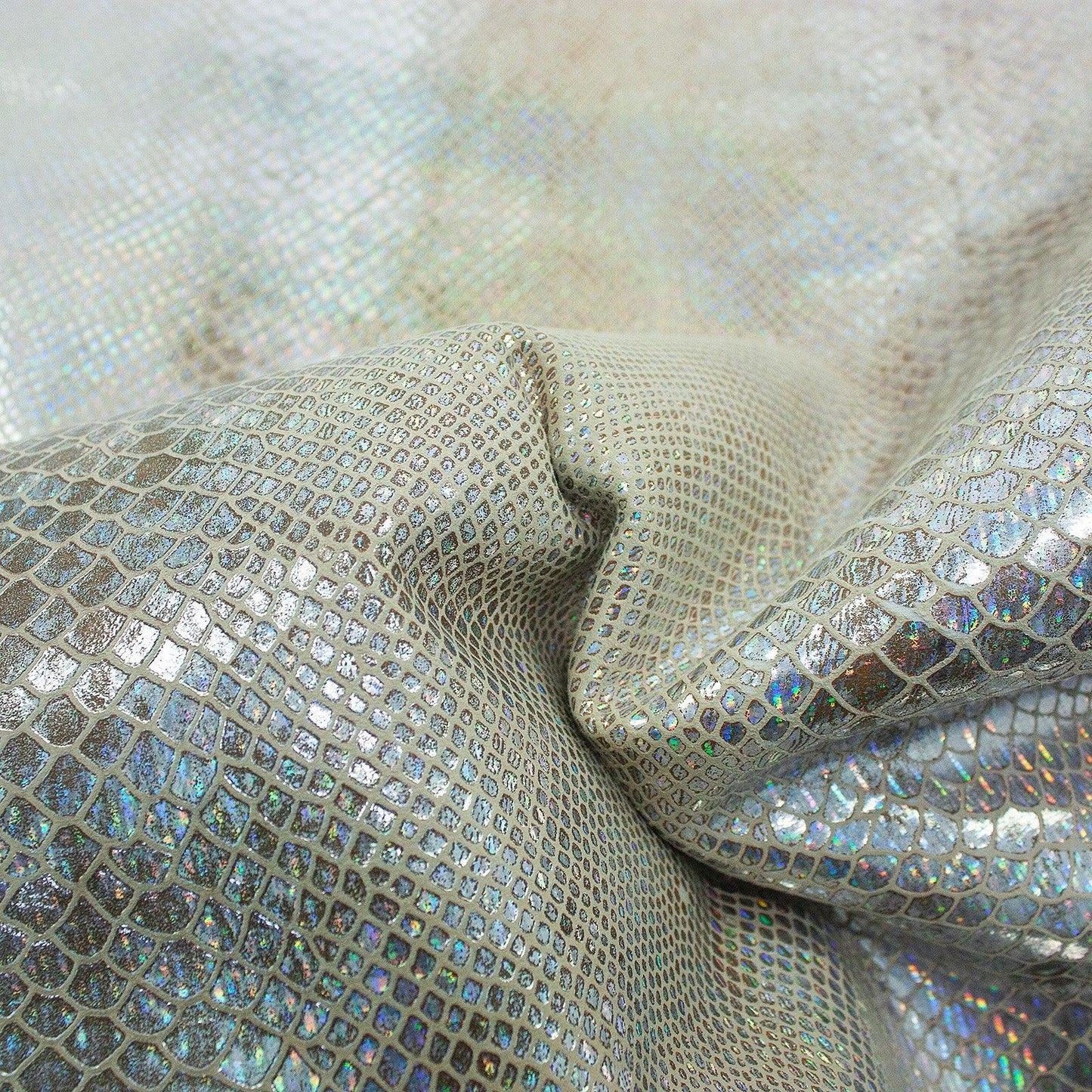 Piece of worn multi-colored faux snake skin