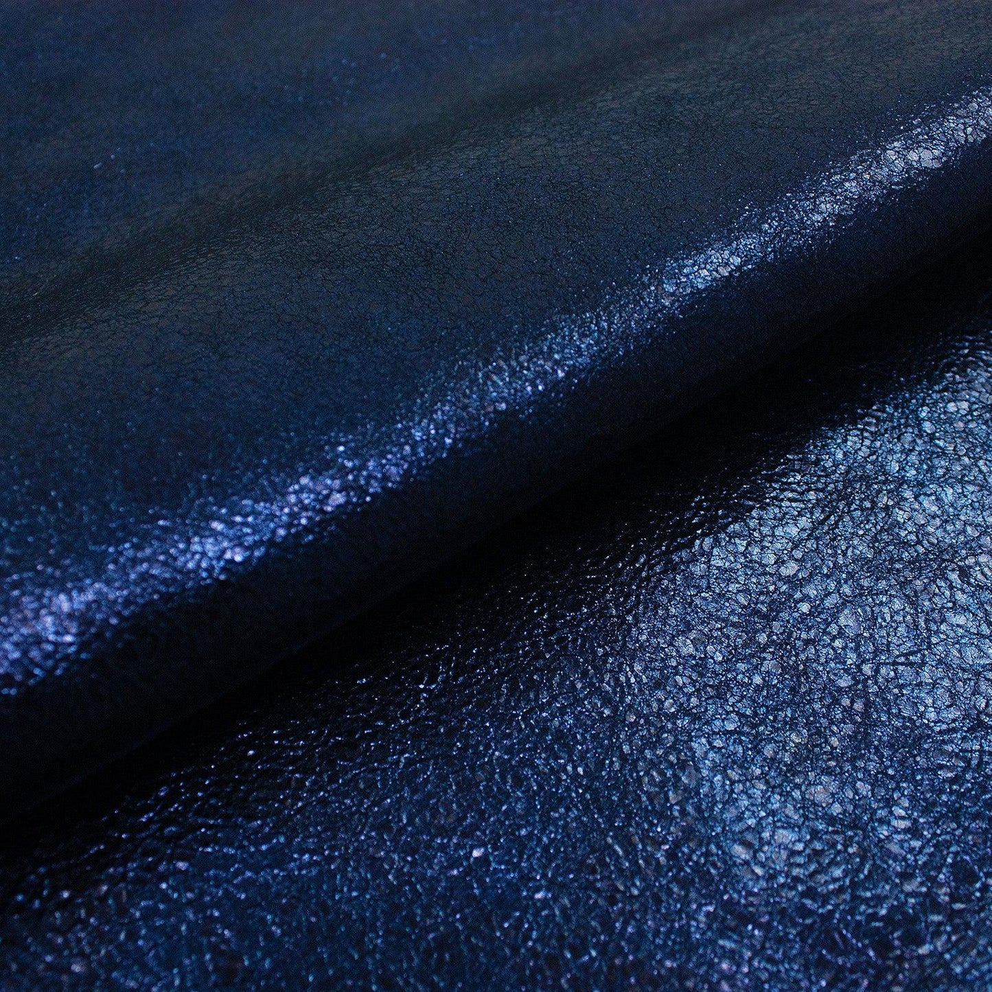 Piece of crinkled blue metallic fantasy leather