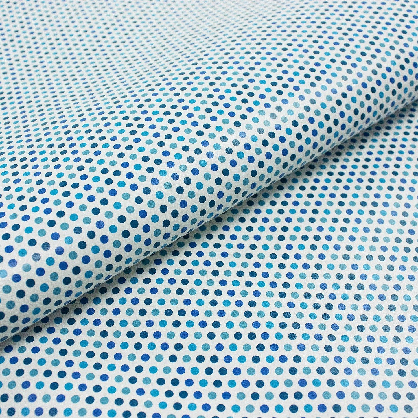 Fantasy polka dot leather piece in blue tones