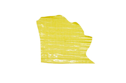 Piece of wrinkled, aged yellow patent leather