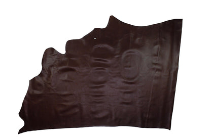 Aged mahogany brown cowhide leather piece